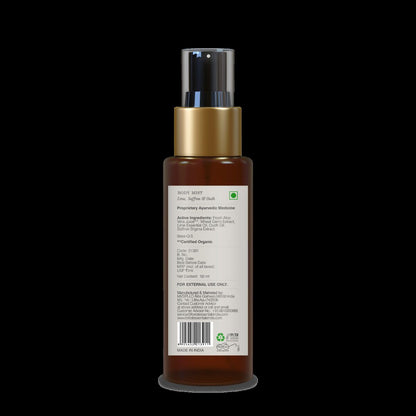 Forest Essentials Lime Saffron & Oudh scented body mist bottle with a floral design and elegant label.