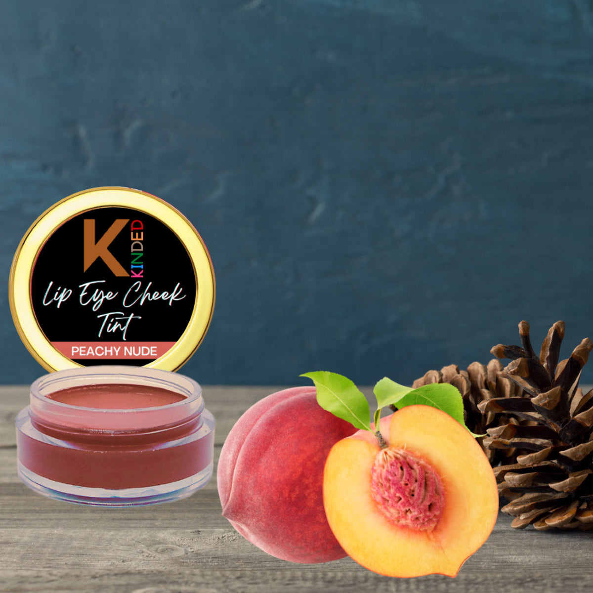 KINDED Peachy Nude Lip, Eye, and Cheek Tint in a sleek tube, showcasing the versatile, natural peachy nude shade.