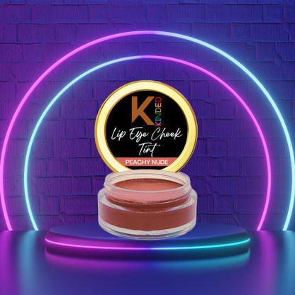 KINDED Peachy Nude Lip, Eye, and Cheek Tint in sleek container, showcasing its natural peachy nude shade for a versatile look.
