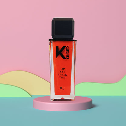 KINDED Lip, Eye & Cheek Tint in Sangria Orange with Vitamin E, featuring a vibrant, blendable formula for a natural glow.