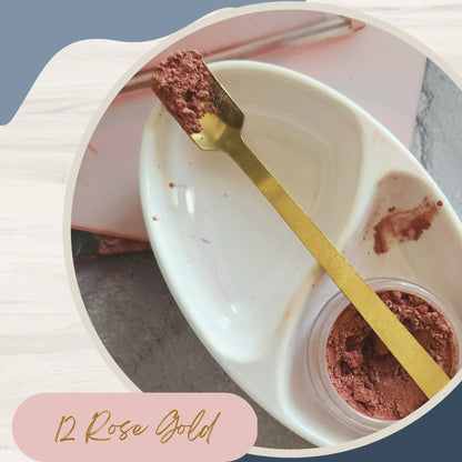 KINDED loose shimmer makeup foil pigment powder in rose gold, showing a sparkling, finely milled cosmetic product in a container.