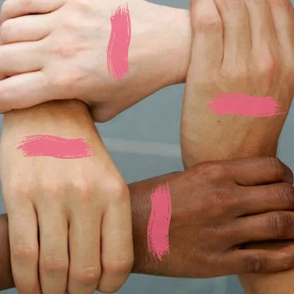 KINDED Liquid Lip Colour in Barbie Pink, a vibrant lipstick and lip gloss with a glossy finish, shown on a model's lips.