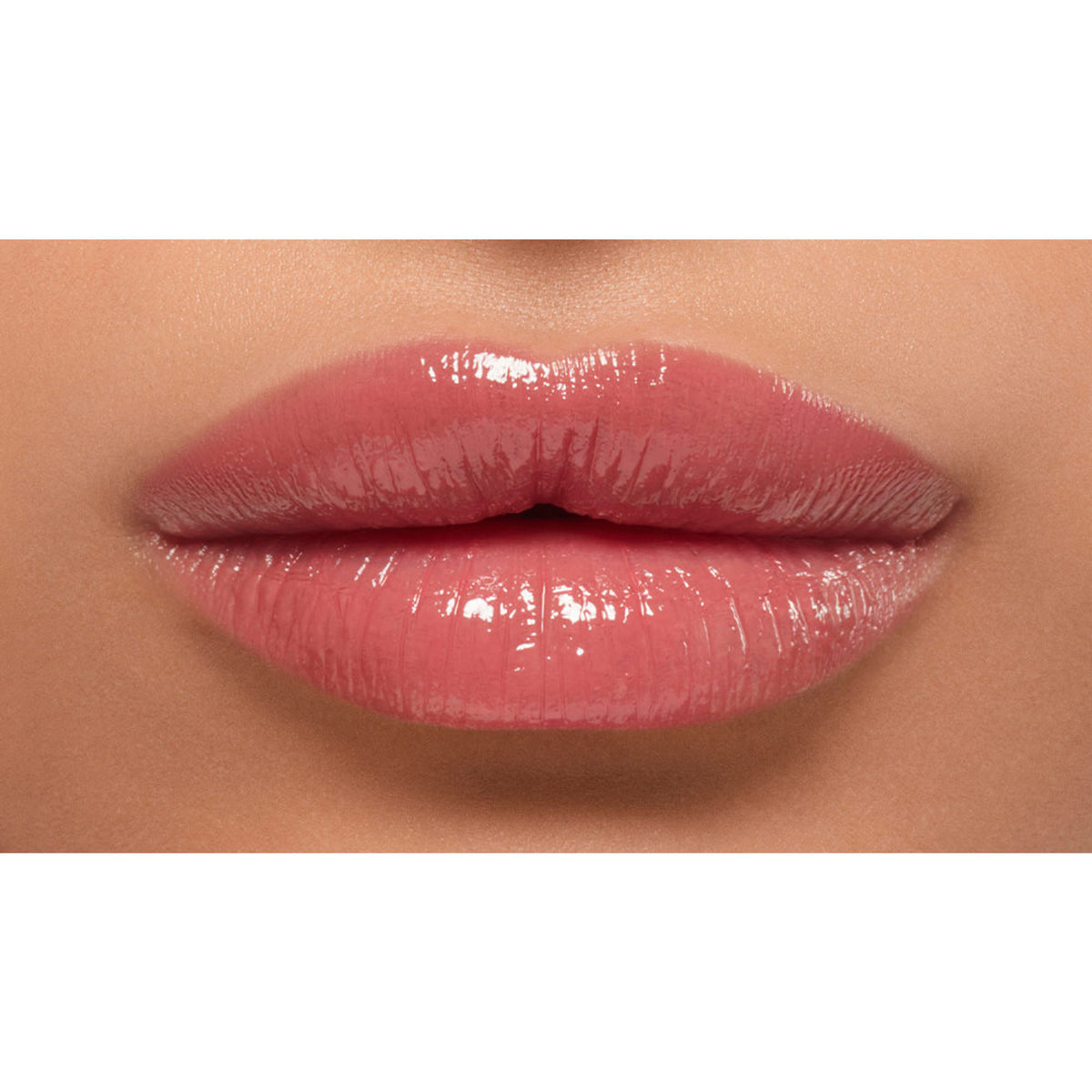 Lancome Lip Idole Butterglow Hydrating Lip Balm in shade Idole Nude, showing a smooth, high-shine lip balm with a neutral nude color.