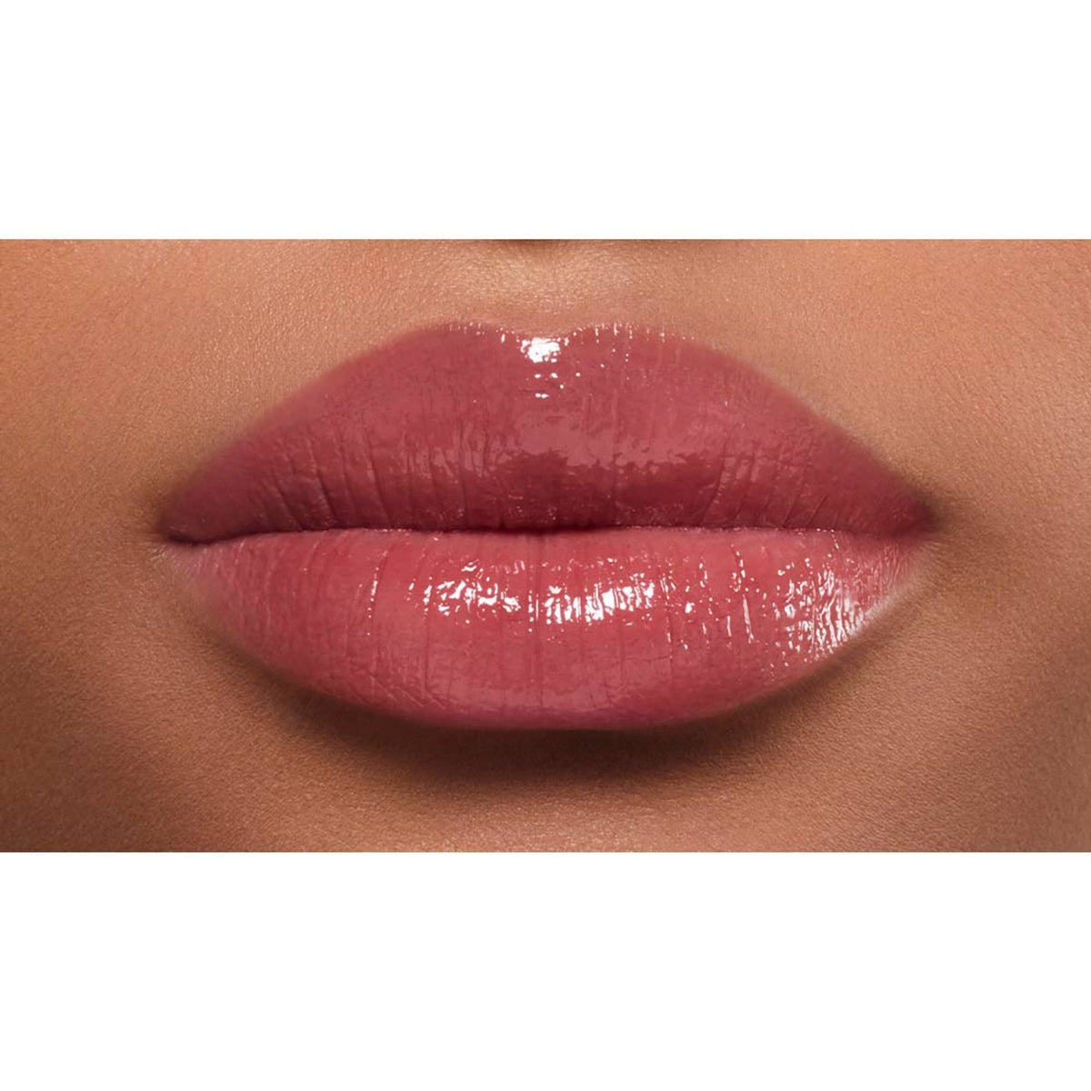 Lancome Lip Idole Butterglow hydrating lip balm in 60 Million Dollar Berry, with a high-shine, glossy finish on smooth lips.