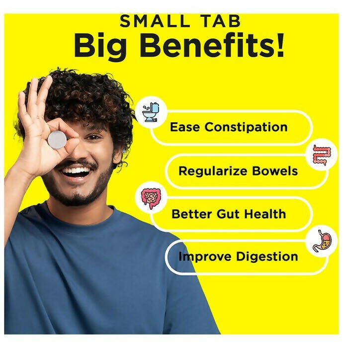 Auric Poop Easy Ayurvedic effervescent tablets in a clear glass, showing the tablet dissolving in water for digestive support.