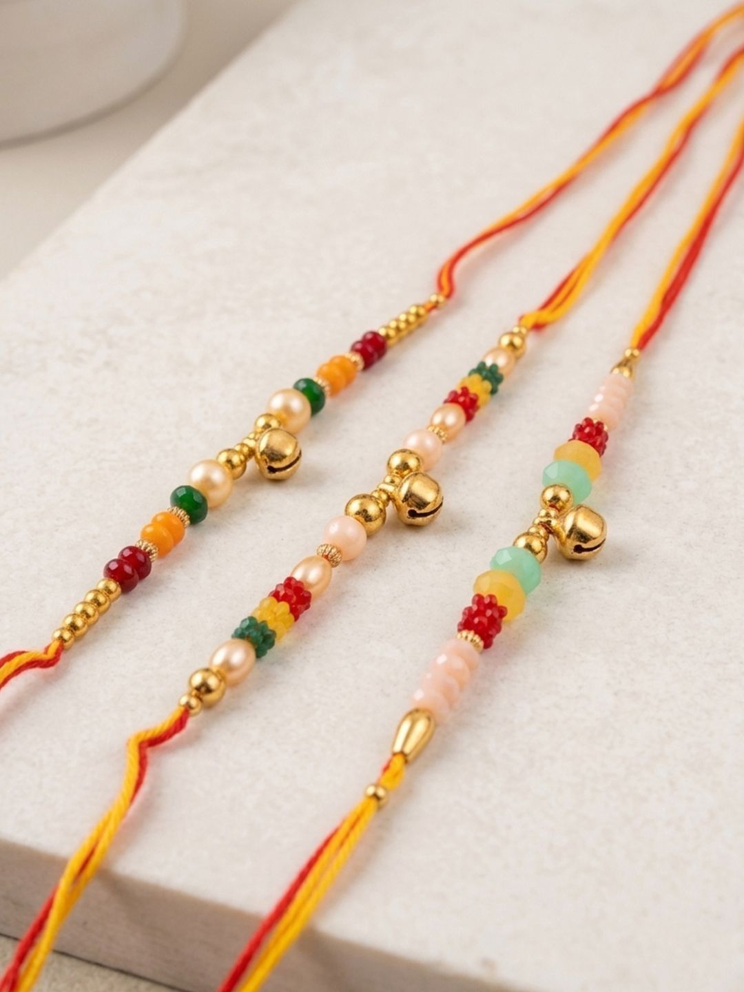 Anouk Set Of 3 Artificial Beads Orange Thread Rakhi With Roli Chawal Chandan Mishri