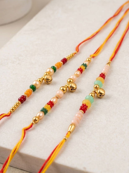 Anouk Set Of 3 Artificial Beads Orange Thread Rakhi With Roli Chawal Chandan Mishri