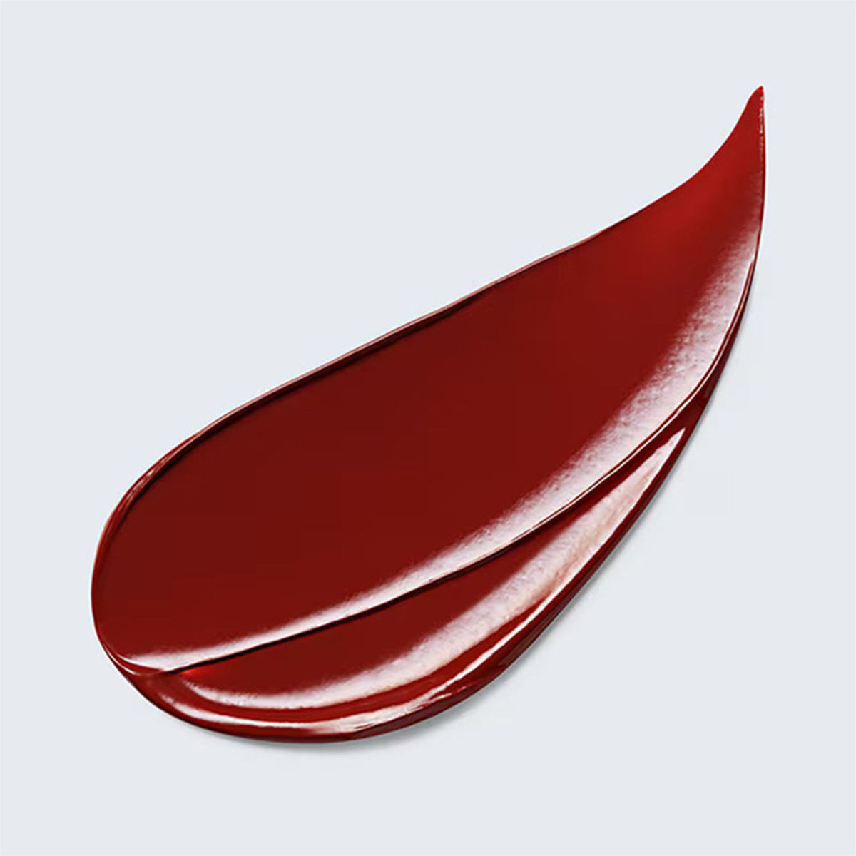 Estee Lauder Pure Color Explicit Slick Shine Lipstick in Heat Of The Moment with sleek, shiny coral-orange lipstick bullet.