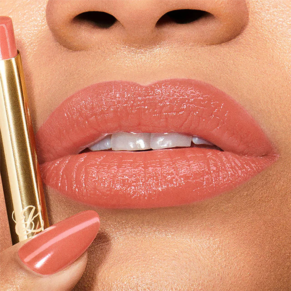 Estee Lauder Pure Color Explicit Slick Shine Lipstick in Wrong Number shade, close-up of the sleek tube and lipstick bullet.