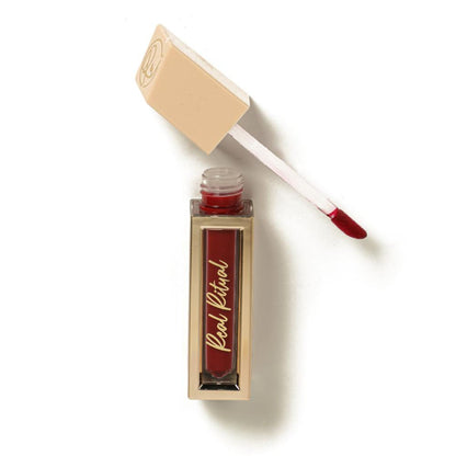 The Real Ritual Liquid Matte Lipstick in shade 107 Kaveri, featuring a sleek tube and applicator with rich, creamy lipstick visible.