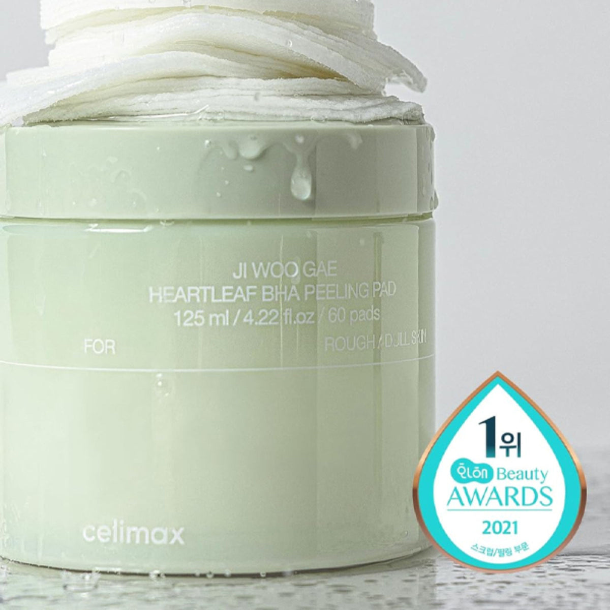 Celimax Ji Woo Gae Heartleaf BHA Peeling Pad with exfoliating, calming, and sebum control features, shown on a skincare tray.
