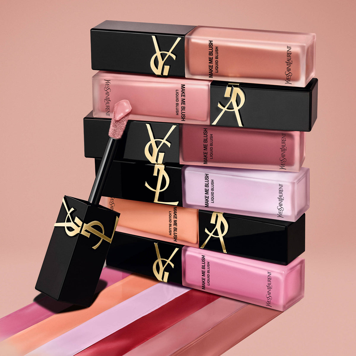 Yves Saint Laurent Make Me Blush liquid blush in shade Coral Clash, featuring a sleek bottle with coral-colored blush visible inside.