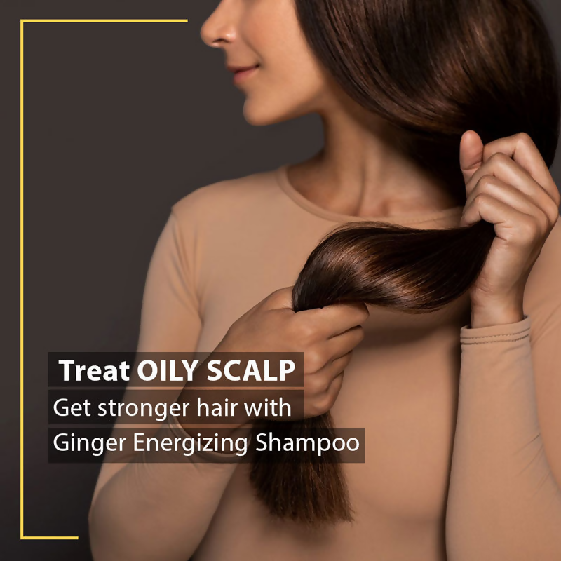 De Fabulous Ginger Energizing Shampoo bottle with orange and gold label, showcasing the product's natural ingredients and branding.