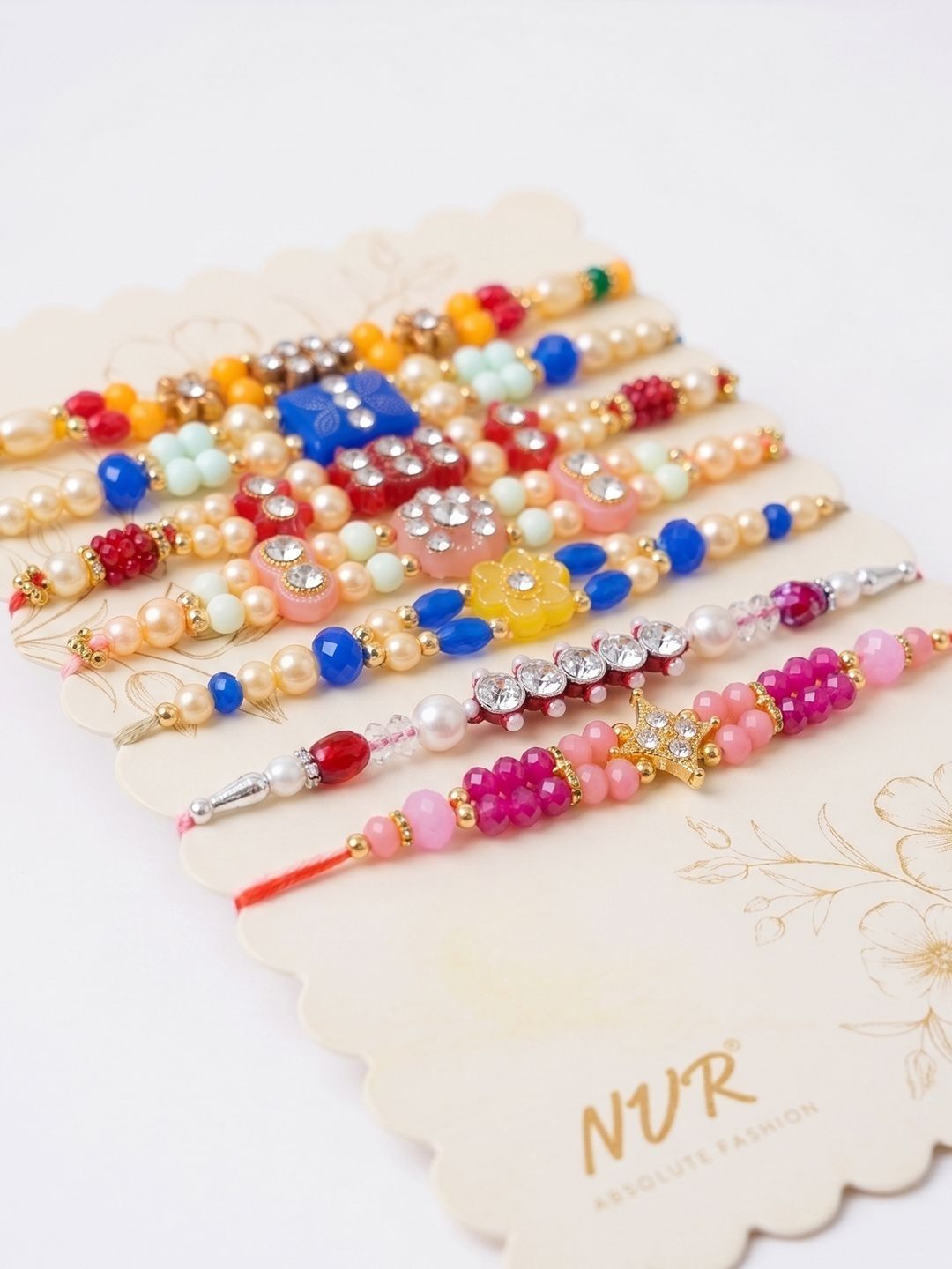 Anouk Set Of 7 Multicolor Designer Thread Rakhi With Roli Chawal Chandan Mishri