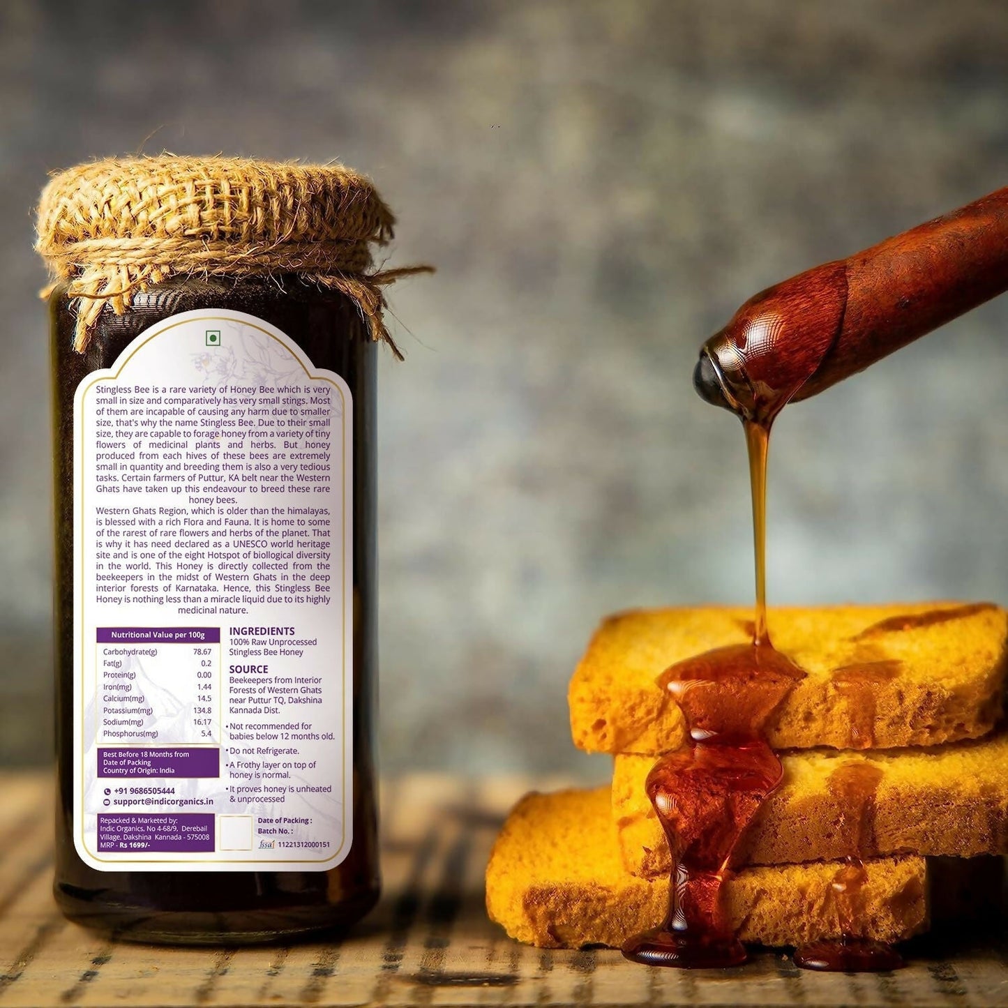 Small jar of Indic Organics Stingless Bee Raw Honey from Western Ghats, showcasing golden honey in a clear glass jar.