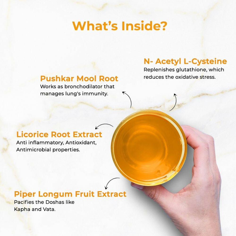 Auric Lung Detox Ayurvedic Effervescent Tablets in a clear glass with tablets dissolving in water, promoting respiratory health.