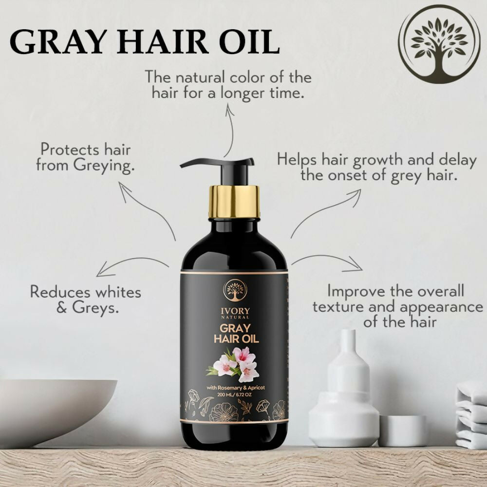 Ivory Natural gray hair oil restore with natural black shine, featuring a clear bottle and droplet applicator, on a white background.