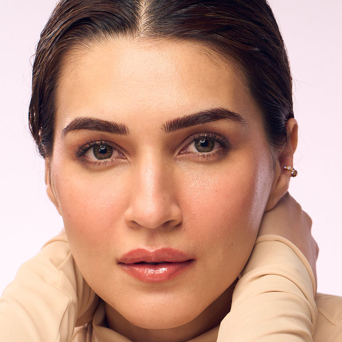 Hyphen by Kriti Sanon hazel vitamin-infused peptide lip balm showing smooth, moisturized lips and hydrating formula.