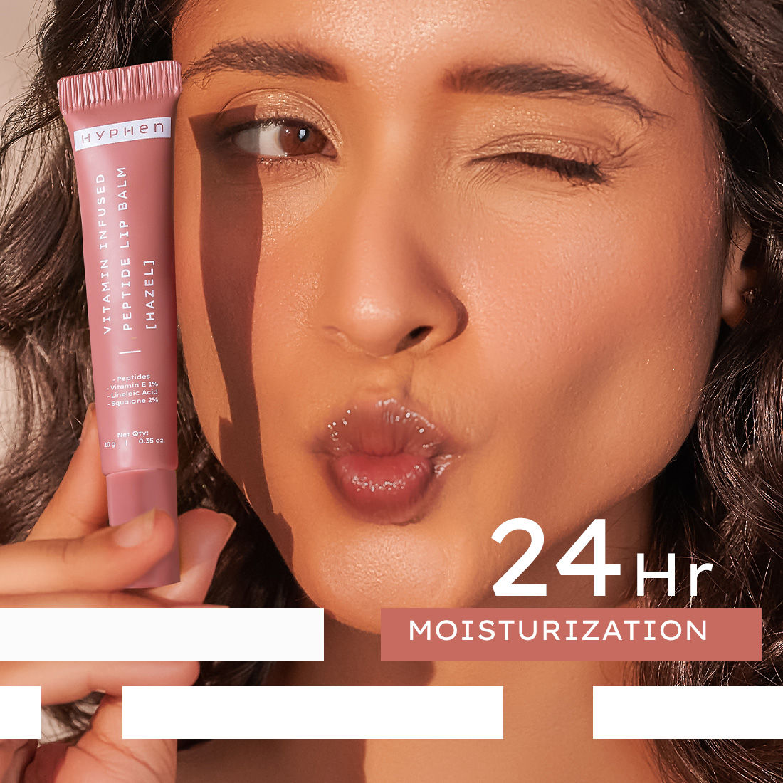 Hyphen by Kriti Sanon hazel vitamin-infused peptide lip balm showing smooth, moisturized lips with a sleek balm container.