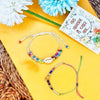 Dhiyona Set Of 2 Artificial Beads Thread Rakhi With Roli Chawal Chandan Mishri