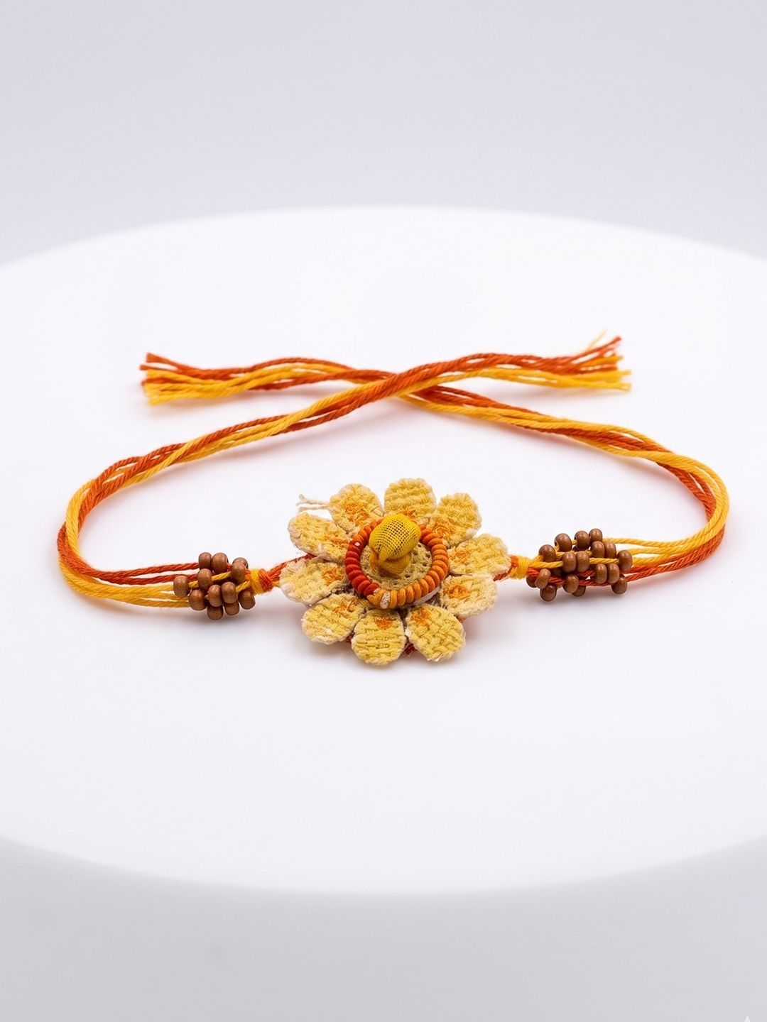 Anouk Yellow Floral Seed Thread Rakhi With Roli Chawal Chandan Mishri