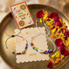 Dhiyona Set Of 2 Artificial Beads Thread Rakhi With Roli Chawal Chandan Mishri