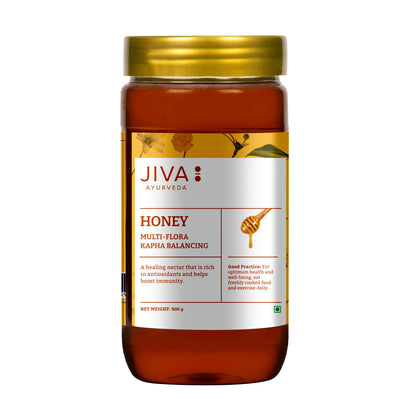 Jiva Ayurveda Honey in a 500g jar, natural and pure, with golden color and smooth texture, ideal for spreads and recipes.