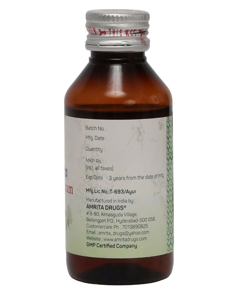 Amrita Dhanwantaram Ayurvedic Thailam in a glass bottle with dropper, traditional herbal oil for wellness and healing.