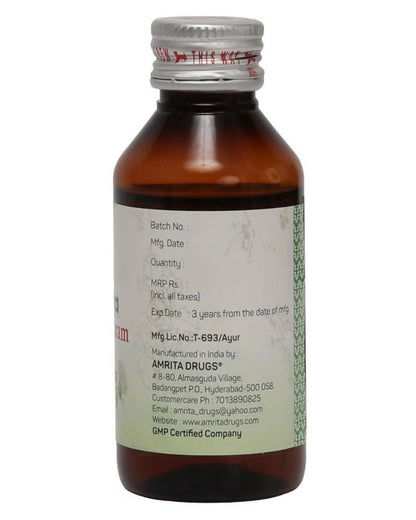 Amrita Dhanwantaram Ayurvedic Thailam in a glass bottle with dropper, traditional herbal oil for wellness and healing.