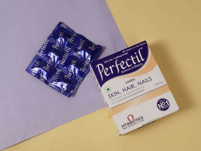 Perfectil Skin Hair Nail supplement tablets showing the bottle and tablets on a white background.
