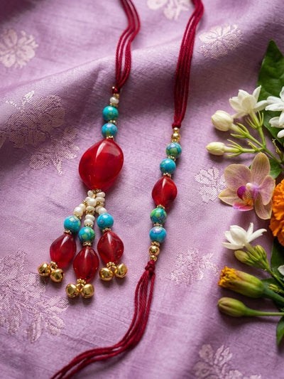 Indyancart Set Of 2 Artificial Beads & Gold Toned Ghungroo Bhaiya Bhabhi Rakhi With Roli Chawal