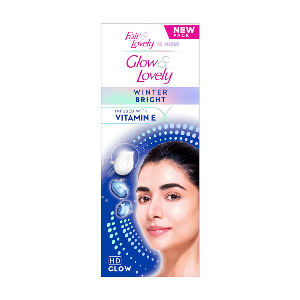 Glow & Lovely Winter Glow Face Cream jar with white and pink packaging, showcasing a smooth, creamy texture.
