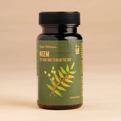 Isha Life Neem and Turmeric Ayurvedic capsules in a clear bottle, showcasing natural herbal supplement for health and wellness.