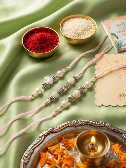 Anouk Set Of 3 White Pearls Thread Rakhi With Roli Chawal Chandan Mishri