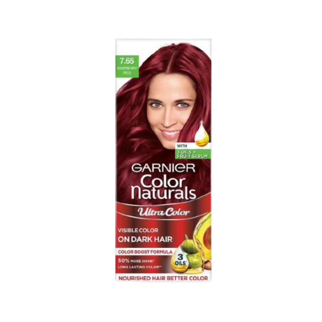 Garnier Color Naturals Ultra Hair Color in 7.65 Raspberry Red, showing vibrant red hair color in a tube with packaging