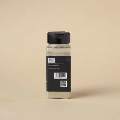Isha Life herbal tooth powder and toothpaste combo in a natural setting, showcasing eco-friendly packaging and traditional herbal ingredients.