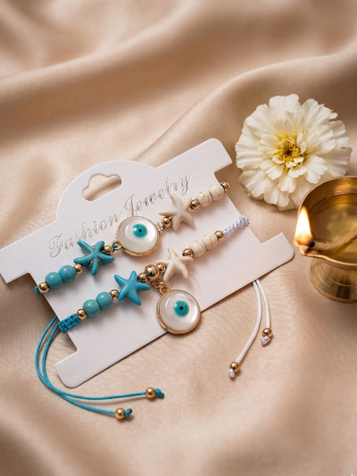 Indyancart Set Of 2 Blue Evil Eye & White Pearl Bhaiya Bhabhi Rakhi With Roli Chawal Chandan