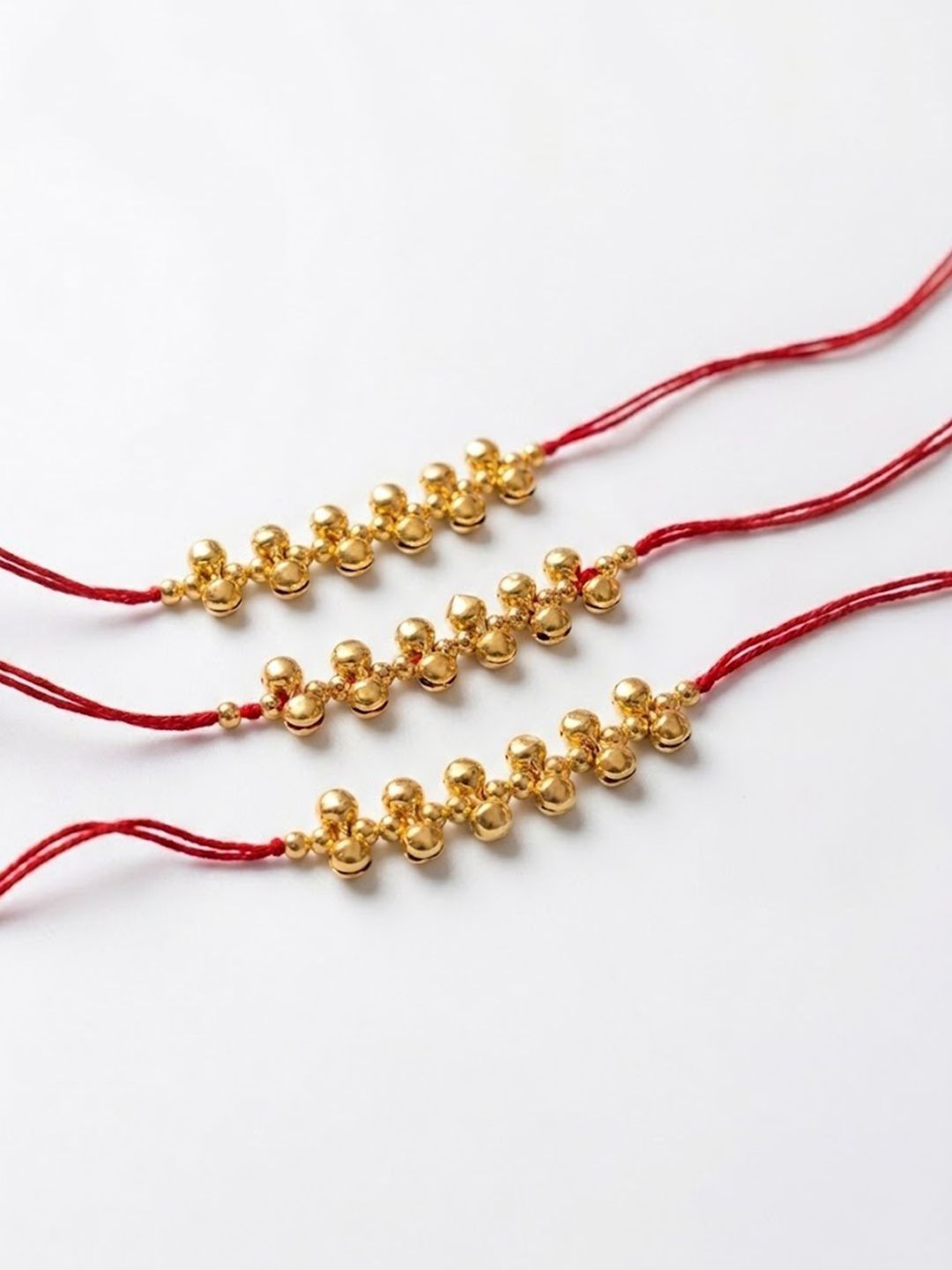 Anouk Set Of 3 Gold Toned Ghungroo & Red Thread Rakhi With Roli Chawal Chandan Mishri