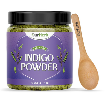 OurHerb organic indigo leaves powder for black hair color, shown in a natural heap with green and blue-green leaves.