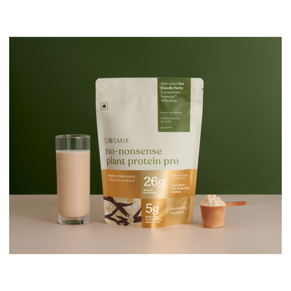 Cosmix No Nonsense Plant Protein Pro Kerala Vanilla Bean health drink in a glass with vanilla bean and plant protein powder.