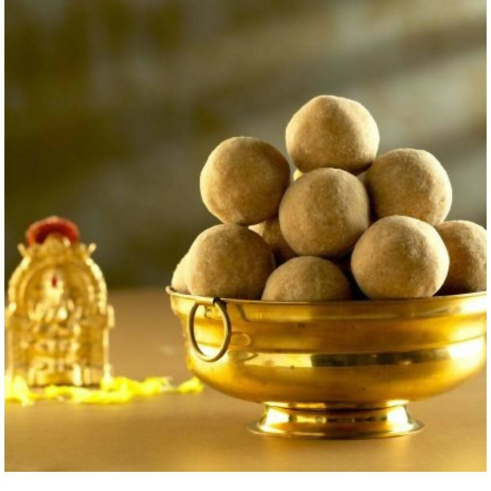 G Pulla Reddy Bellam Sunnundalu, North Indian sweet with sesame and jaggery, displayed in traditional packaging.