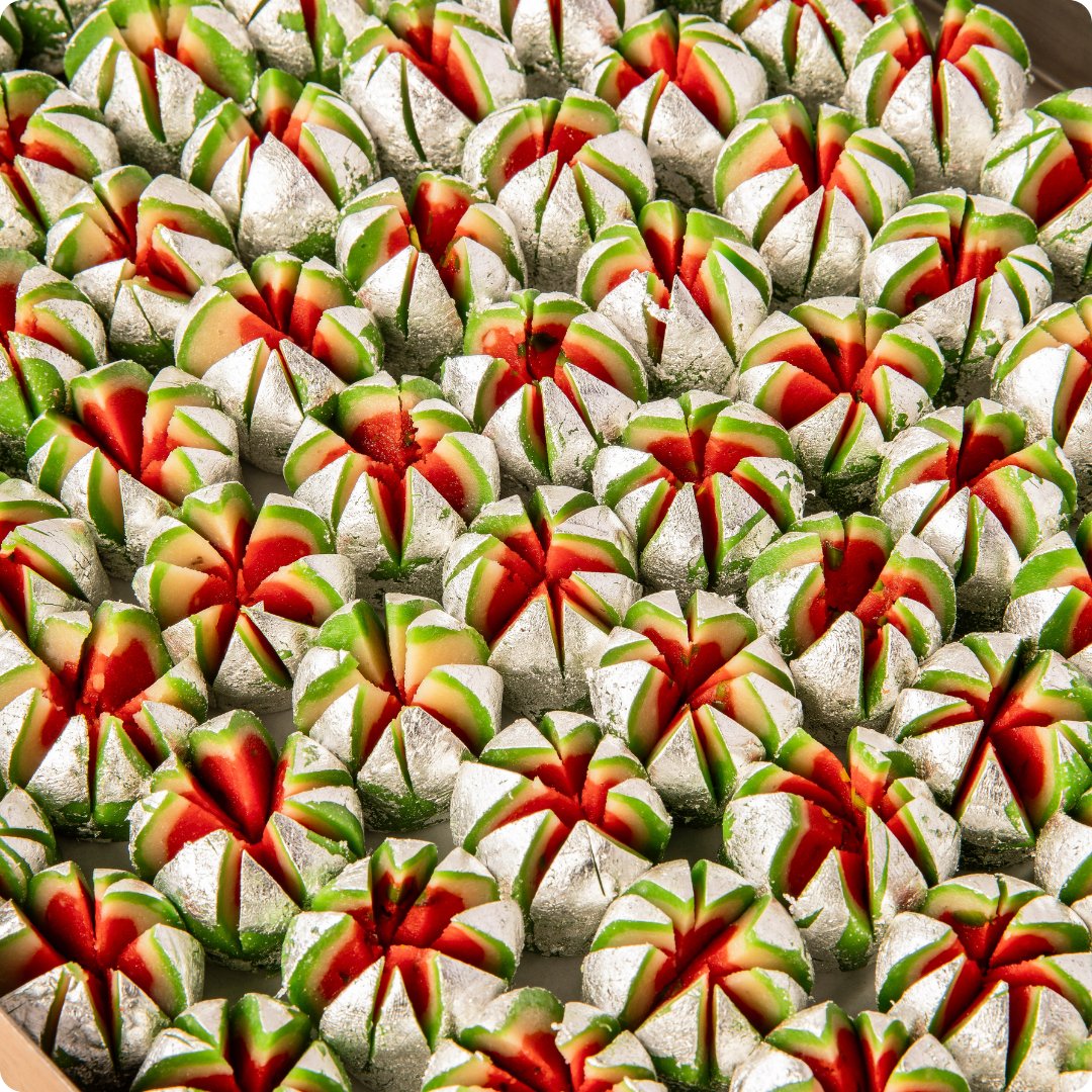 Plate of Shree Mithai Kaju Flower, North Indian sweet made with cashews, showcasing its intricate flower shape.