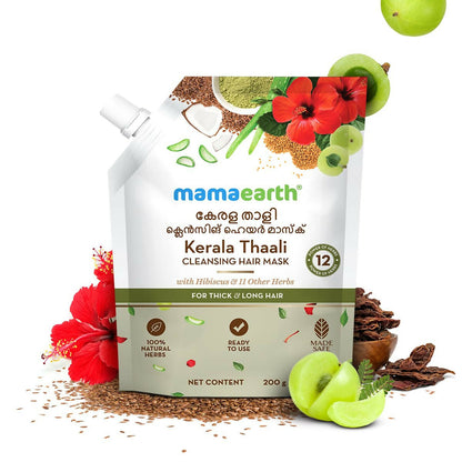Mamaearth Kerala Thaali Hair Mask with 12 herbs for thick, long hair, showcasing the natural herbal ingredients in a jar.