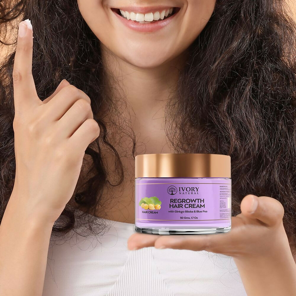 Ivory Natural hair growth cream in a jar, showing a smooth, creamy texture for stronger, healthier hair care.