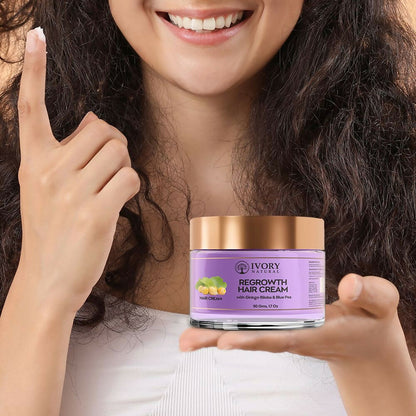 Ivory Natural hair growth cream in a jar, showing a smooth, creamy texture for stronger, healthier hair care.