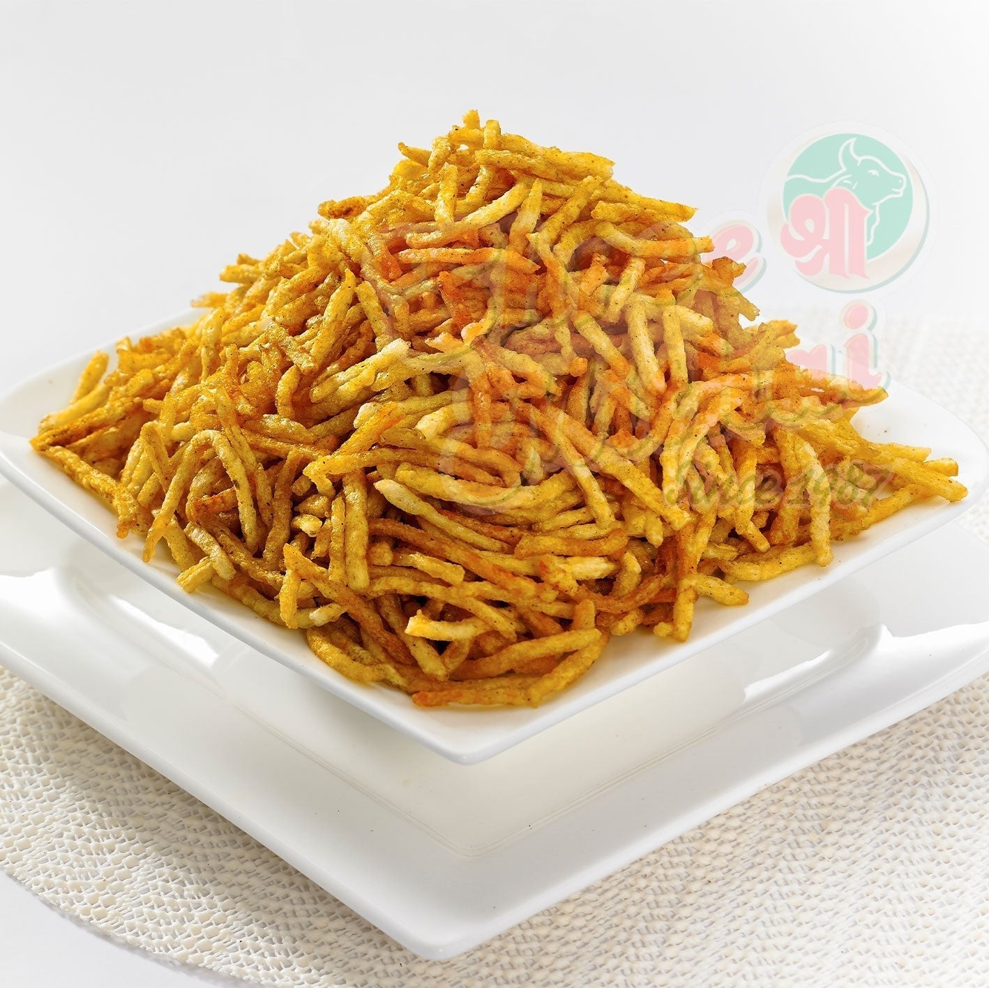 Shree Mithai Masala Potato Sticks, North Indian snack with crispy, spiced potato sticks in a vibrant snack bowl.