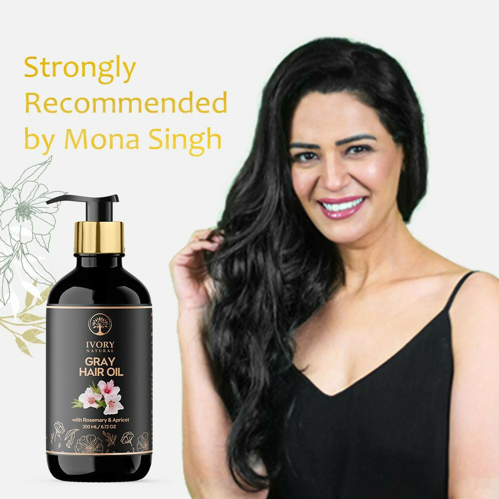 Ivory Natural gray hair oil restore with natural black shine, featuring the hair oil bottle with a white cap and gray liquid inside.