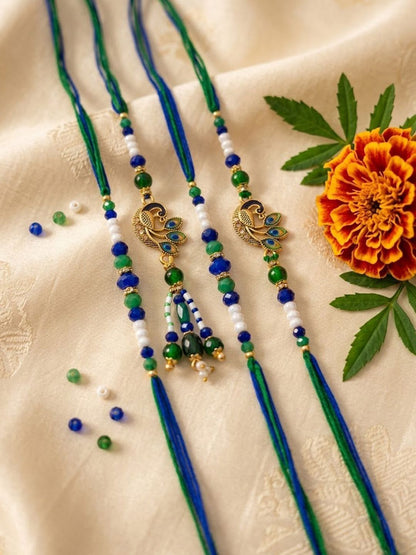 Anouk Set Of 4 Green Peacock Design Artificial Beads Thread Rakhi With Roli Chawal