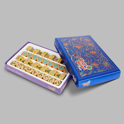 Assorted North Indian sweets from Shree Mithai, featuring colorful mercury-shaped Indian desserts on a platter.