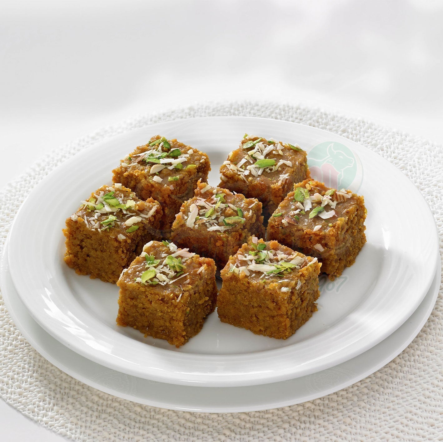 Creamy Shree Mithai Milk Halwa, a classic North Indian sweet with rich, smooth texture and vibrant yellow color.
